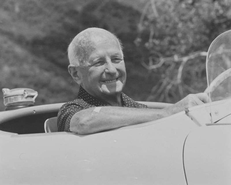 Donald M. Healey enjoying a spin in a 1955 Austin-Healey 100S