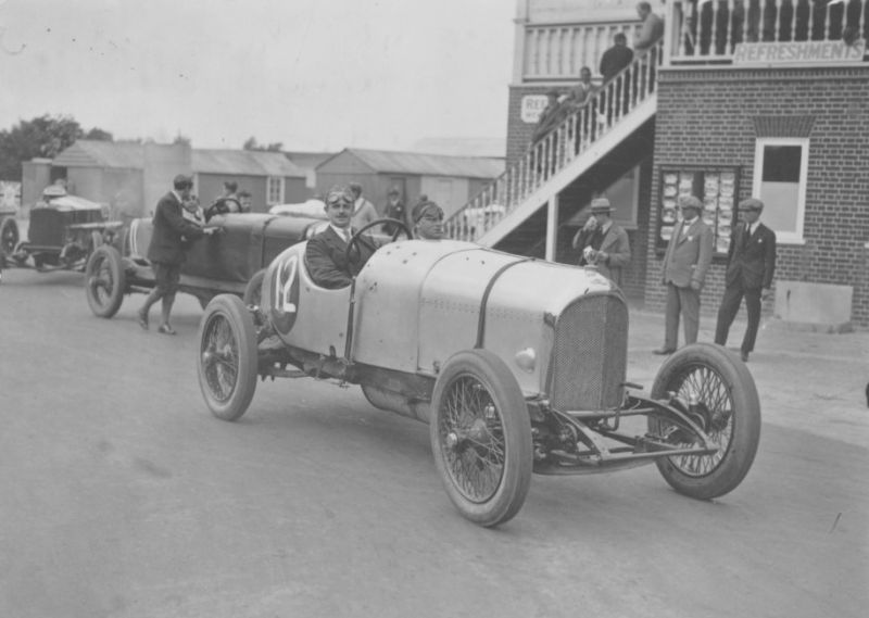 Racing driver W.G. Barlow at the wheel of a Bentley at Brooklands race track, August 1922