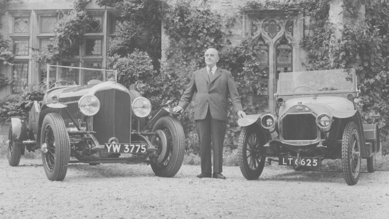 Walter Owen W.O. Bentley standing with a Bentley and D.F.P