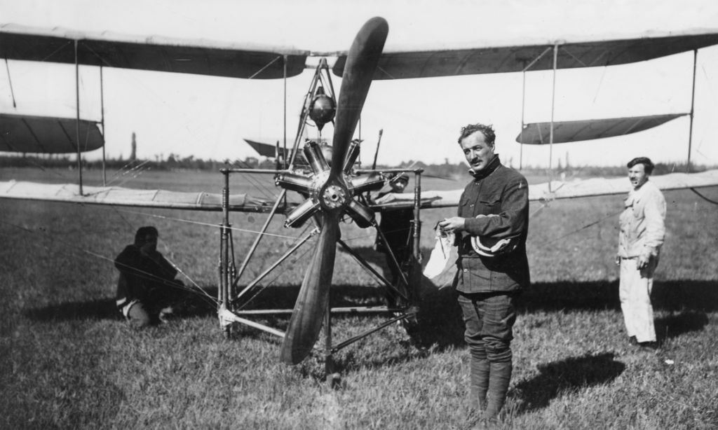 Armand in front of a Dufaux-5 biplane with a Gnome 70 seven-cylinder rotary engine