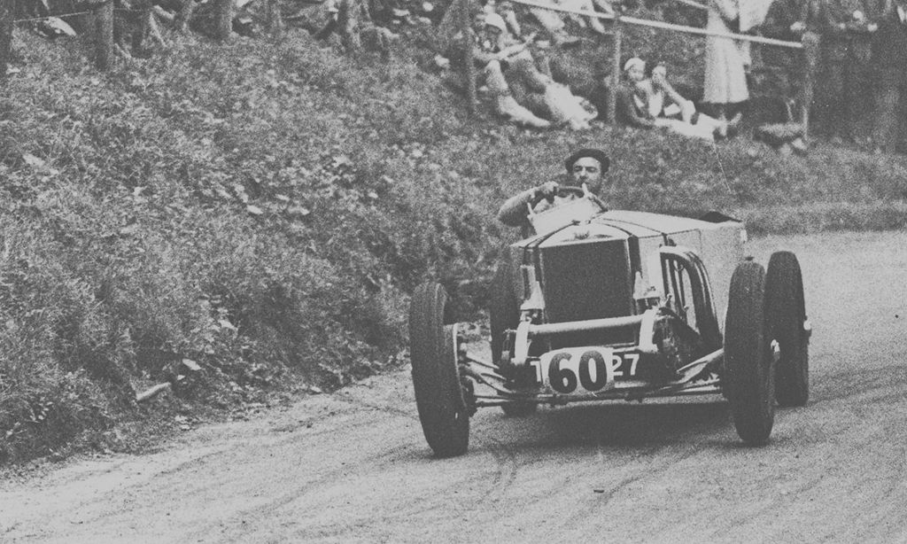 Raymond May behind the wheel of his Invicta Type S 4 1/2 litre Low Chassis Tourer by Carbodies competing in the Shelsley Walsh Hill Climb, 1932